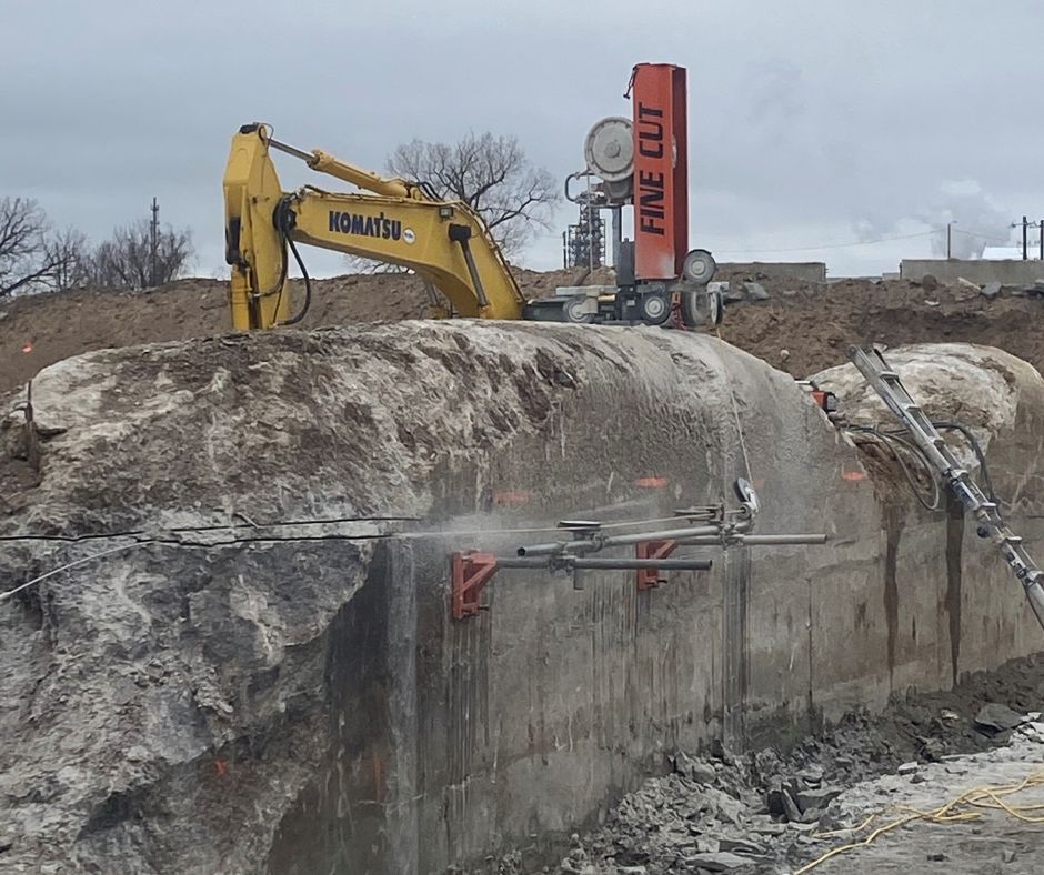 Fine Cut crew uses professional concrete wire sawing equipment to remove a reinforced bridge section.